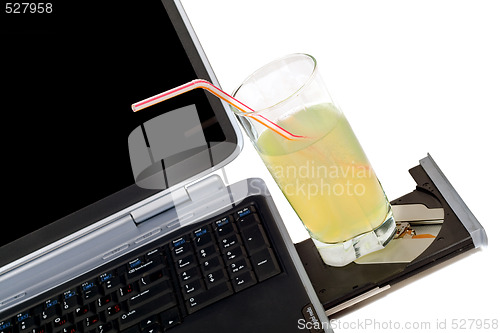 Image of The laptop and cocktail. Isolated on white