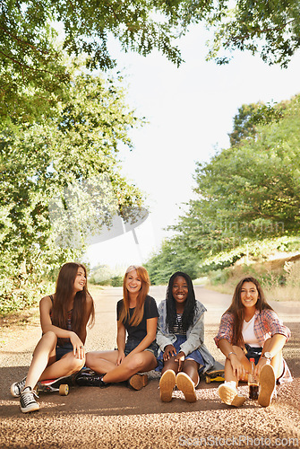 Image of Friends, road and girl with skateboard in smile at forest for hobby in outdoor and activity in California. Diverse group, teen and sit for happiness on school holiday or break and together in woods