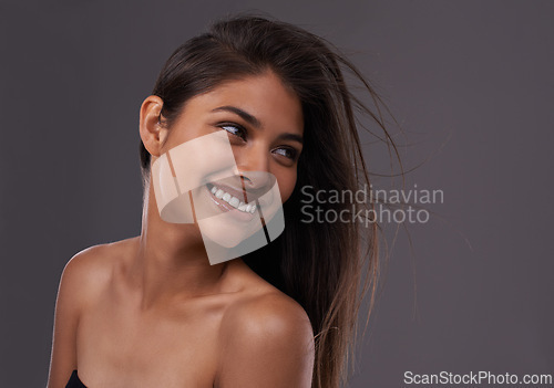 Image of Woman, studio and haircare with happy beauty, Indian female person with luxury and salon treatment. Thinking of keratin blowout or styling for results and wellness, isolated and glowing model