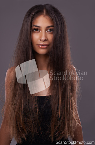 Image of Portrait, woman or messy hair for haircare, beauty or texture change for growth, health or scalp in studio. Female model, damaged or long as haircut, weak or split end in treatment on grey background