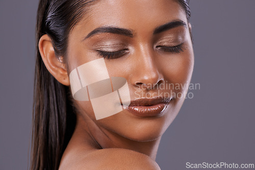 Image of Shine, makeup or woman with closed eyes, cosmetics or dermatology on grey studio background. Person, model and girl with skincare routine or luxury with treatment or foundation with glow or aesthetic