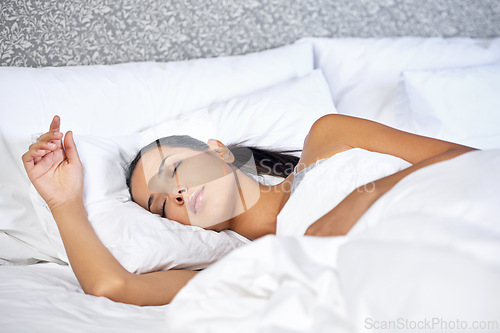 Image of Woman, peaceful and morning sleep in room, home and weekend rest for energy. Bed, dreaming and relax in apartment for tired and exhausted female person, comfort for fatigue with nap for mental health