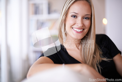 Image of Portrait, woman and smile in living room or home for leisure, break and enjoy on couch. Female person, happy and satisfied with comfort or joy in lounge, sofa and positive for self care and wellbeing