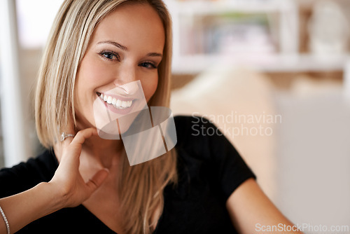 Image of Face, woman and smile in lounge or home for leisure, break and enjoy in couch. Female person, happy and satisfied with comfort or joy in living room, sofa and positivity for self care in house