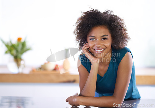 Image of Portrait, smile and afro with black woman in kitchen of home as real estate agent for house viewing. Realtor, morning and curly hair with happy young broker in modern apartment for staging showcase