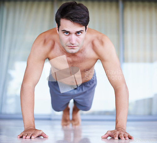 Image of Portrait, fitness and man during push up, sports and working out at gym center. Exercise or plank for core muscle and health or well being for body, pilates and fit male sportsman at outdoor studio