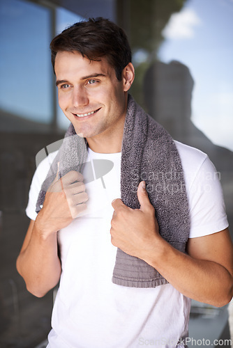 Image of Happy man, towel and hygiene with satisfaction for grooming or morning freshness by window at home. Handsome, young male person with smile for cleanliness, masculine or health and wellness at house