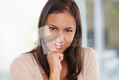 Image of Happy woman, portrait and face with confidence or hand on chin in natural beauty at home. Female person, brunette or casual model with smile in relax for positive attitude or satisfaction at house