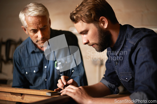 Image of Man, dad and coach with wood, workshop and family business or apprenticeship. Father, adult son and design with artisan, carpentry and together for startup or mentor with learning and working