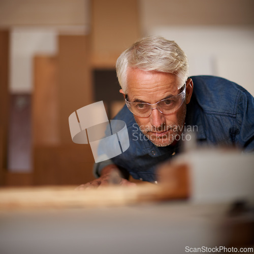 Image of Male carpenter, thinking and planning in workshop, safety and glasses in small business. Design, woodwork and production lumber or timber, contractor and materials or tools for furniture building