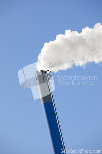 Image of Chimney, smoke and sky for industrial outdoor in environment for pollution, waste and emission of smog and chemical in factory. Coal, energy and manufacturing with chemicals for ecology and climate