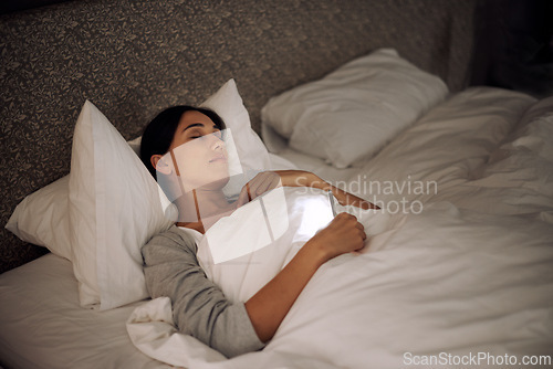 Image of Woman, phone and sleep in peace, bed and relaxation under blankets in pajamas for wellness. Female person, laying and rest for home, night and dreaming in sleepwear for comfort and social media