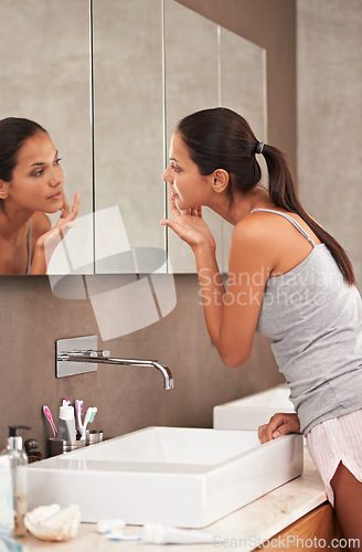 Image of Bathroom, face in mirror and woman for skincare, beauty and wellness in morning routine. Health, dermatology and person in reflection for pimple, home or facial for cleaning, hygiene and grooming