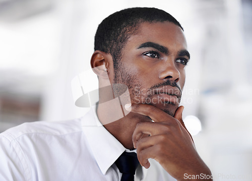 Image of Businessman, thinking and ideas for new opportunity, startup and professional in formal clothes. Black man, corporate and planning or thoughts in office environment, vision and salesman in workplace