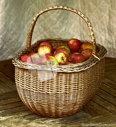 Image of Closeup, apple and basket for autumn, still life and artwork of healthy, food or agriculture. Organic, fruit and floor for ecosystem, sustainability or zero waste for natural eco friendly snack