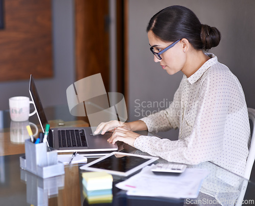 Image of Businesswoman, working and office with laptop, desk and online in corporate career. Technology, tablet and computer for financial advisor, consultant and paperwork with calculator for budget research