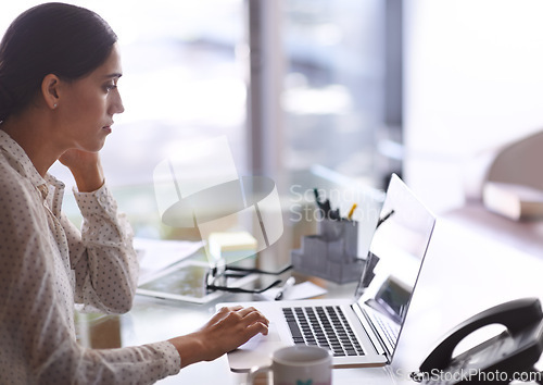 Image of Businesswomen, laptop and working at office, desk and computer for corporate worker. Technology, online and concentrated female financial advisor, deadline and screen on table for budget and money