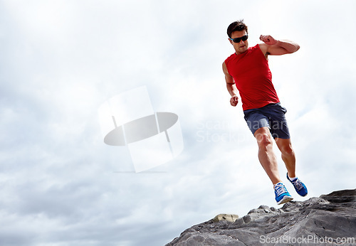 Image of Man, running and beach for fitness, health and wellness in activewear and sunglasses. Athlete male person, jog and seaside for sport, train and nature workout or exercise for cardio outdoor mockup