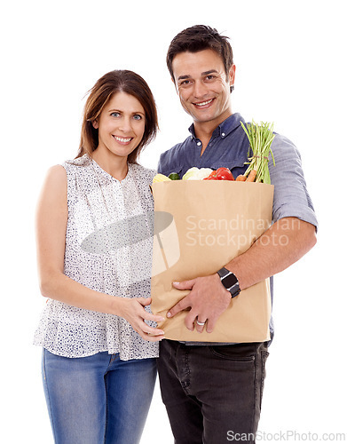 Image of Happy couple, portrait and bag with groceries for food, natural sustainability or fashion on a white studio background. Man and woman with smile for grocery shopping, casual clothing or supermarket
