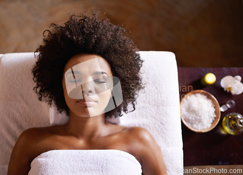 Image of Top view, spa and massage with black woman, vacation and wellness with luxury and treatment with stress relief. African person, client or girl with health and weekend break with grooming and relaxing