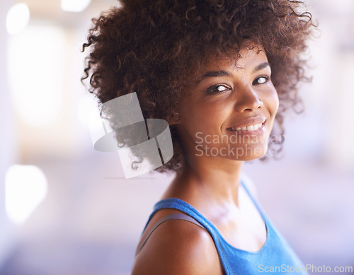 Image of Woman, portrait and happiness in fashion with lens flare, natural beauty and casual outfit in summer. African person, face and smile with afro hairstyle, wellness or trendy style with bokeh in Africa