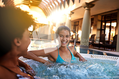 Image of Happy woman, friends and laughing with jacuzzi for funny joke or humor at hotel, resort or hot tub spa together. Face of female person or people with smile for fun vacation or relaxation in warm pool