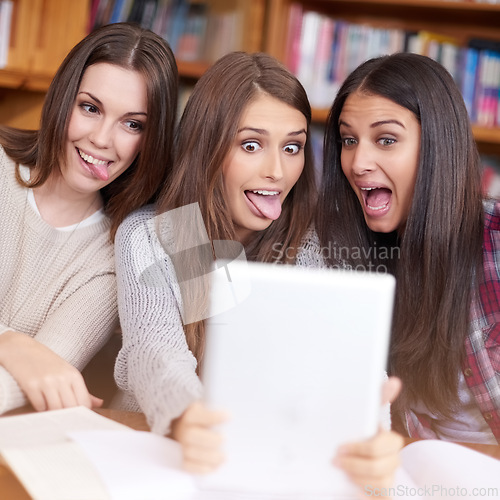 Image of Women, students or tablet selfie in college library or bonding together for crazy update on social media. Learners, touchscreen or post online as goofy friends or solidarity with care in university