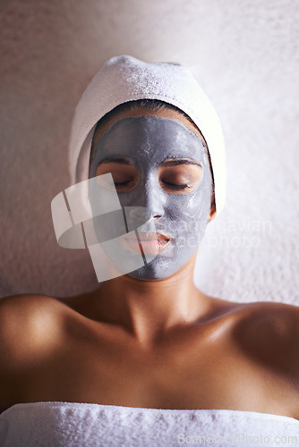 Image of Woman, top view with face mask and beauty with skincare, charcoal for treatment and dermatology at day spa. Peace, calm and detox for skin, healthy with wellness and cosmetics for facial ad self care