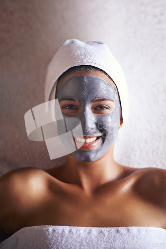 Image of Happy woman, top view with face mask and beauty in portrait for skincare, charcoal for treatment and dermatology at day spa. Detox for skin, healthy and wellness with cosmetics for facial self care