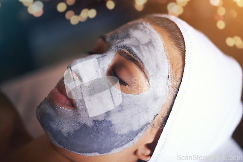 Image of Woman, closeup with face mask and beauty for skincare, charcoal or clay for treatment and dermatology at day spa. Detox for skin, healthy and wellness with cosmetics, calm and self care with facial