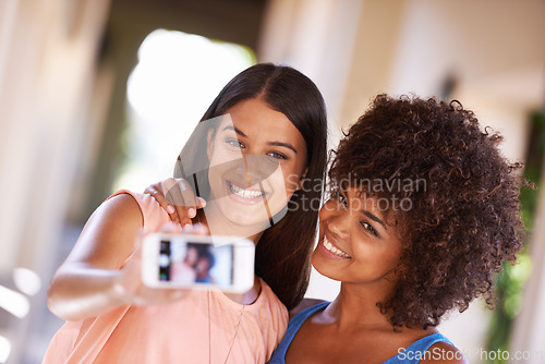 Image of Friends, phone screen and happy selfie in city for travel, fun or bonding with vacation memory. Smartphone, photography or women outdoor for social media, adventure or profile picture with a smile