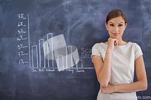 Image of Portrait, blackboard and business with woman, graphs and financial adviser with charts, economy and investment. Face, person and employee with chalk, income or accounting with trading or sales growth
