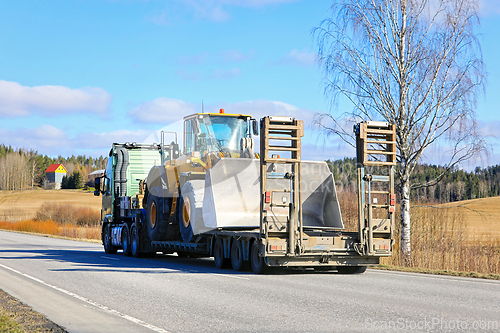 Image of Truck Transports Wheel Loader on Low Loader Semitrailer