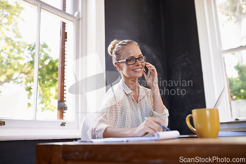 Image of Woman, portrait and happy in home office with phone call for business networking, remote communication and multitasking. Female person, smartphone and conversation for startup, freelance and career.