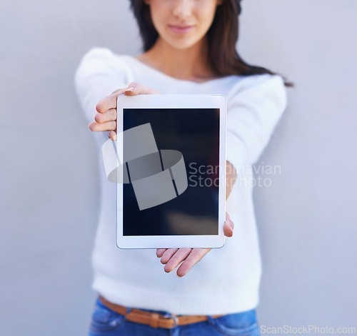 Image of Tablet, show and hands of woman in studio background, smile and happiness for mobile and media. Presentation, female person and girl with digital device, mockup and screen of technology and internet