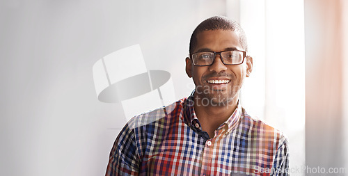 Image of Portrait, business and happy black man in office, workplace or company for startup job. Face, glasses and smile of professional entrepreneur, employee and creative designer on mockup space in Kenya