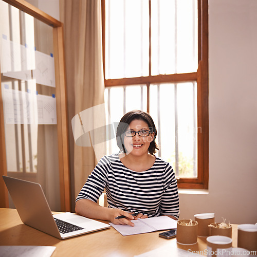 Image of Portrait, ecommerce and woman in home office with small business, laptop and notes for planning. Face, remote work and girl with desk, box and notebook for online order, product inventory and smile.