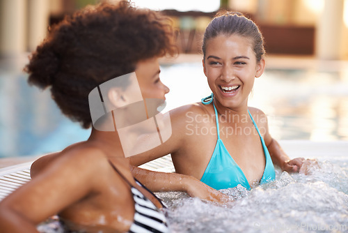Image of Happy woman, relax and laughing with friends in jacuzzi at hotel, resort or hot tub spa together. Face of female person or people with smile for fun bonding, relaxation or hospitality in warm pool