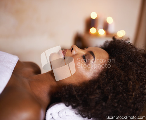 Image of Woman, relax and wellness in spa for beauty, care and cosmetic treatment for break or peace. African person and natural for holistic therapy for skincare, clean and hygiene with towel for rest