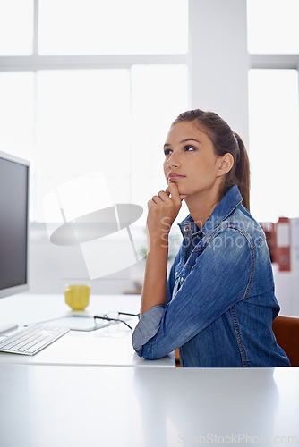 Image of Woman, thinking and decision with computer for creative startup, idea or brainstorming at the office. Female person or employee in wonder or thought for design, choice or planning at the workplace