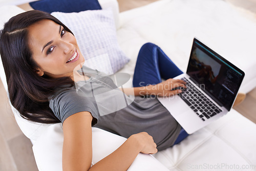 Image of Laptop screen, portrait and happy woman on sofa for social media, blog or web communication at home. Pc, mockup or face of female person a living room for movie search, google it or Netflix and chill