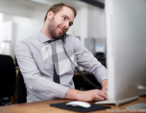 Image of Man, phone and landline in office for customer service with telemarketing, help desk and happy with computer. Call center, employee and consultant with telephone for support, telesales and advice