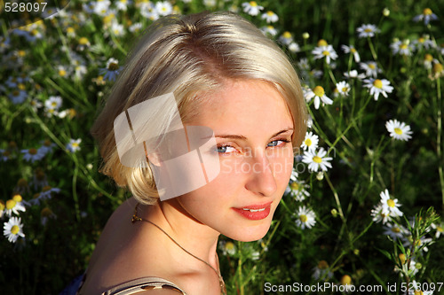 Image of Young Woman With daisy