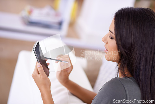 Image of Woman, living room and texting on smartphone with stylus for online research, information or social media for networking. Female person, home and touchscreen on break for internet and entertainment