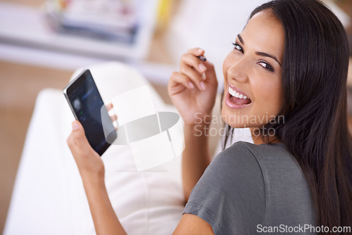 Image of Smile, portrait and woman on a sofa with phone for social media, search or online dating communication at home. Happy, face and female person in living room with smartphone app for google it or chat