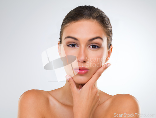 Image of Woman, portrait and confidence in skincare with beauty, cosmetics and dermatology for glow on white background. Face, skincare treatment and wellness for antiaging, shine and natural in studio