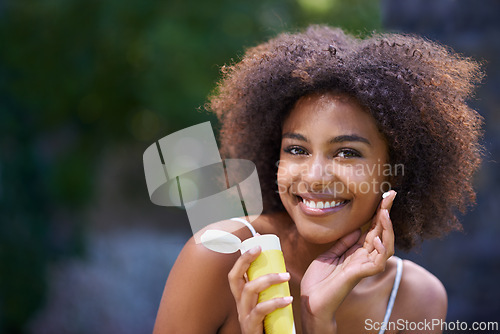 Image of African, woman and sunscreen and hand in nature, body care or lotion for heat or sun protection with natural female person. Smiling, excited girl with product tube or summer fun on holiday retreat