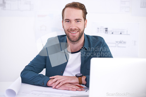 Image of Portrait, laptop and blueprint with architecture man in office with documents for building, design or planning. Architect, construction and industry with confident young developer in workplace