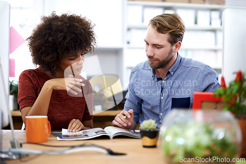 Image of Creative, business people and reading with magazine for information, content or journalism at the office. Man and woman working together with novel, story or news for design or startup at workplace