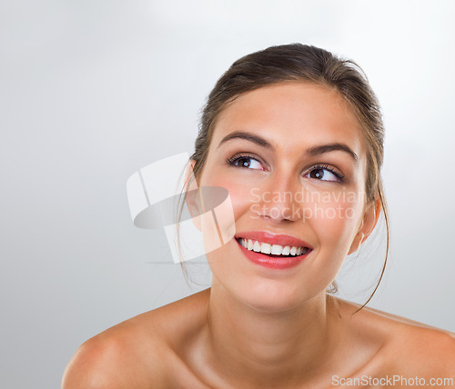 Image of Woman, thinking and skincare with smile for beauty, dermatology and antiaging treatment shine isolated on white background. Reflection, cosmetic care and healthy skin glow with makeup in studio